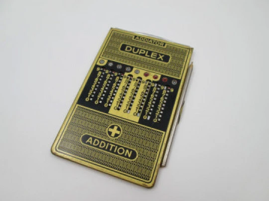 Addiator Duplex pocket mechanical calculator. Gold plated aluminum. Germany. 1950's