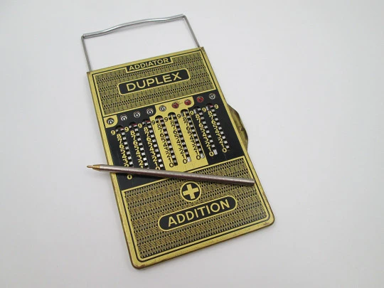 Addiator Duplex pocket mechanical calculator. Gold plated aluminum. Germany. 1950's