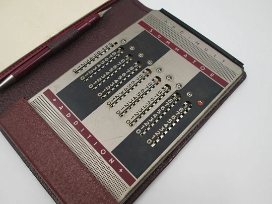 Addimult mechanical calculator. Bitone metal. Cover & marker. 1960s. Germany