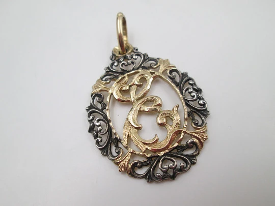 Anagram openwork medal. Sterling silver and vermeil. Vegetable edge. 1980's. Spain