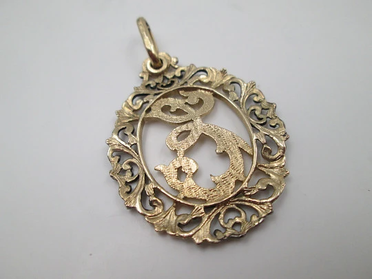 Anagram openwork medal. Sterling silver and vermeil. Vegetable edge. 1980's. Spain