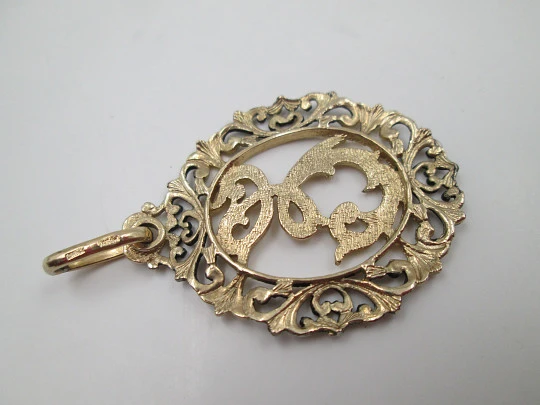 Anagram openwork medal. Sterling silver and vermeil. Vegetable edge. 1980's. Spain