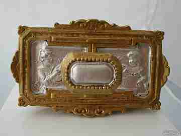 Antique desk bronze blotter. Children's and geometric motifs