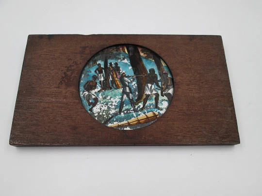 Antique magic lantern slide. Painted glass on wood frame. African colonies. 1910's. Europe