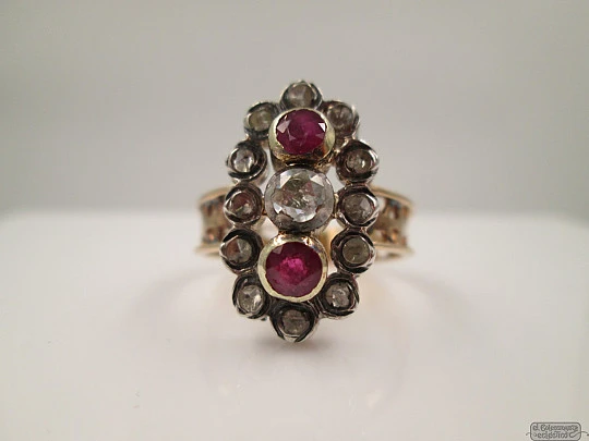 Antique ring. 18 karat yellow gold. Diamonds. Rubies. 1940's