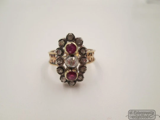 Antique ring. 18 karat yellow gold. Diamonds. Rubies. 1940's