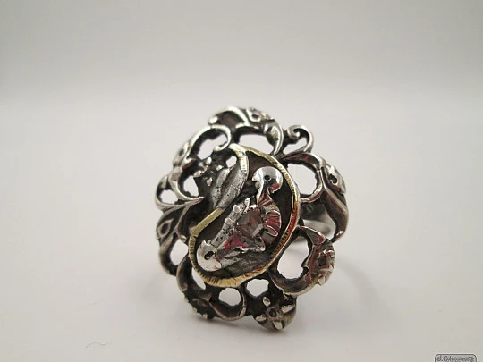 Antique ring. Silver and diamonds. Birds and scrolls. 1910's