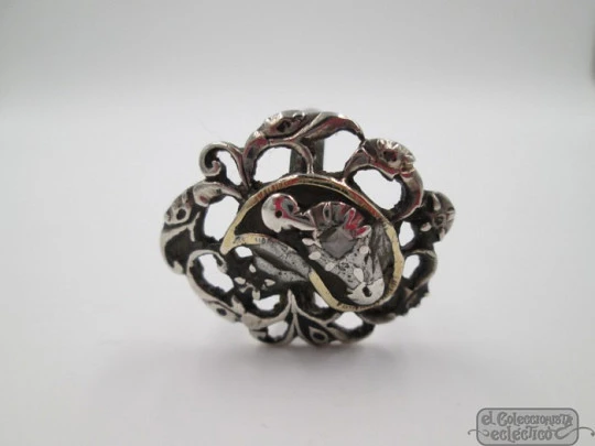 Antique ring. Silver and diamonds. Birds and scrolls. 1910's