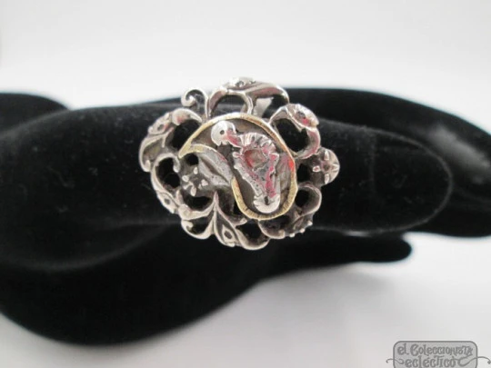 Antique ring. Silver and diamonds. Birds and scrolls. 1910's