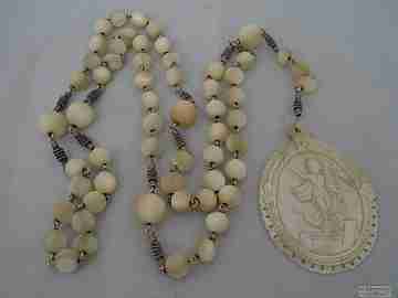 Antique rosary. Silver and mother of pearl. Jesus bas-relief