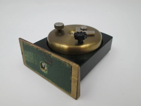 Appella wind-up travel desk alarm clock. Green burnished bronze and golden metal. Swiss