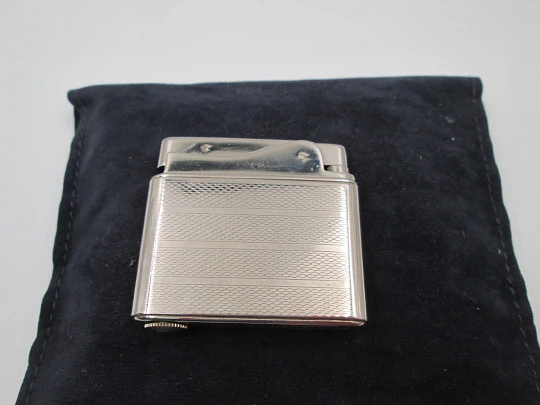 Aristo petrol musical lighter. Silver plated metal. Waves pattern. Austria. 1950's
