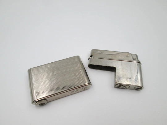 Aristo petrol musical lighter. Silver plated metal. Waves pattern. Austria. 1950's