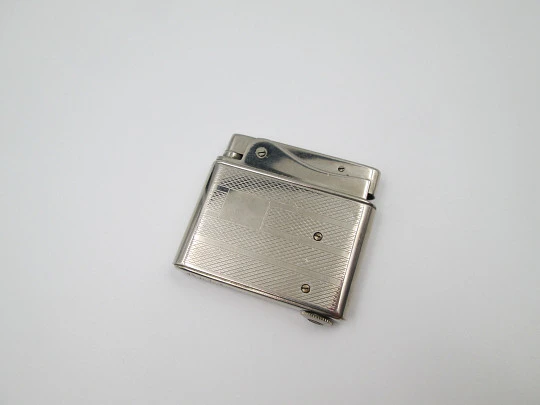 Aristo petrol musical lighter. Silver plated metal. Waves pattern. Austria. 1950's