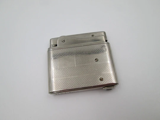 Aristo petrol musical lighter. Silver plated metal. Waves pattern. Austria. 1950's