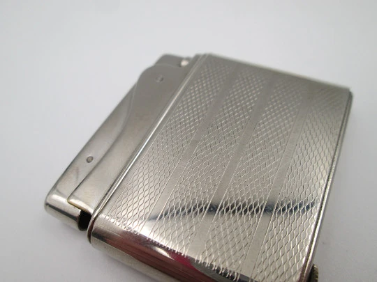 Aristo petrol musical lighter. Silver plated metal. Waves pattern. Austria. 1950's