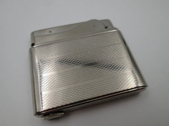 Aristo petrol musical lighter. Silver plated metal. Waves pattern. Austria. 1950's