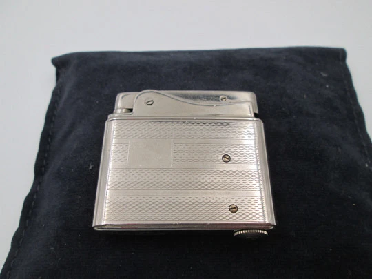 Aristo petrol musical lighter. Silver plated metal. Waves pattern. Austria. 1950's