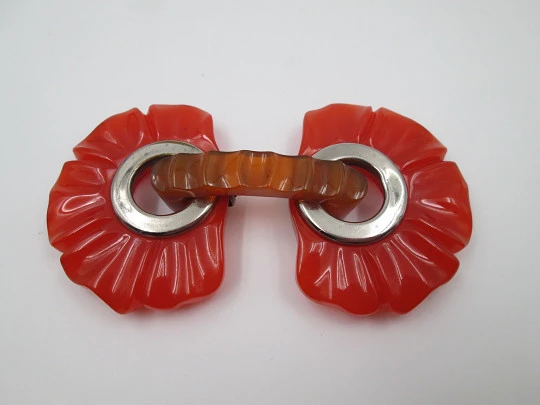 Art deco ladie's orange bakelite belt buckle. Flowers shape design. Silver metal details