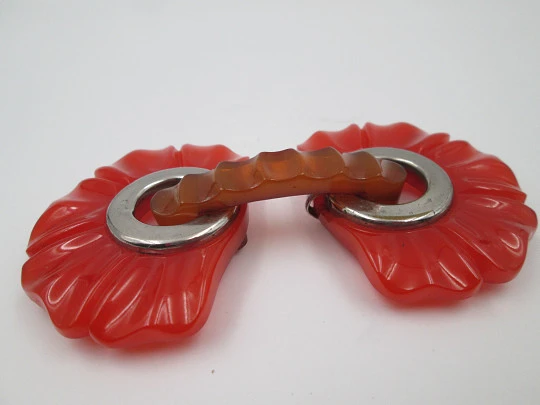 Art deco ladie's orange bakelite belt buckle. Flowers shape design. Silver metal details
