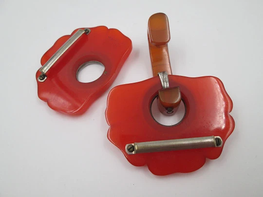 Art deco ladie's orange bakelite belt buckle. Flowers shape design. Silver metal details
