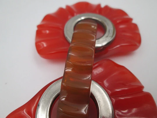 Art deco ladie's orange bakelite belt buckle. Flowers shape design. Silver metal details