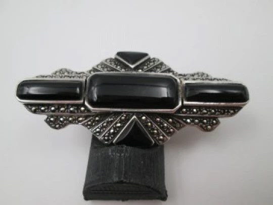 Art Deco style women's brooch. Sterling silver, marcasite gems and onyx. 1960's