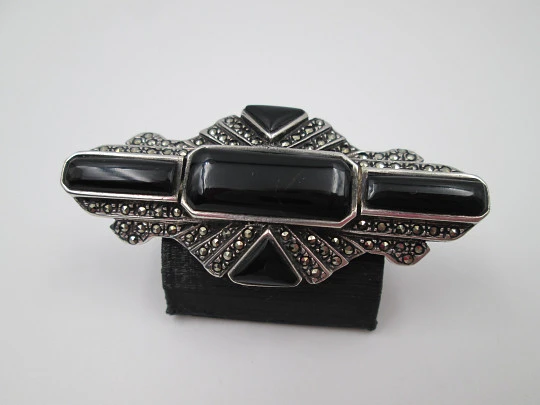 Art Deco style women's brooch. Sterling silver, marcasite gems and onyx. 1960's