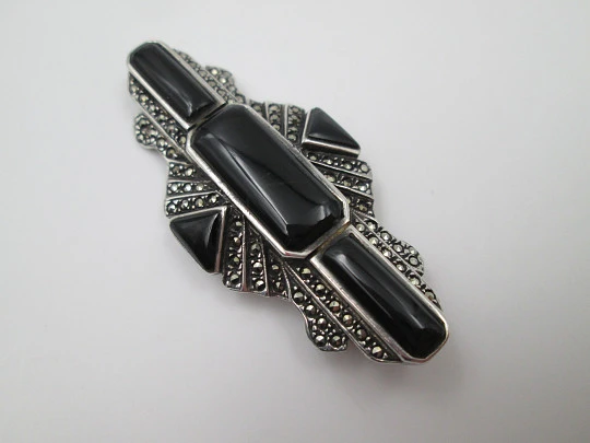 Art Deco style women's brooch. Sterling silver, marcasite gems and onyx. 1960's