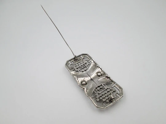 Art deco women's brooch. Sterling silver and rhinestones. Openwork design. Europe. 1930s