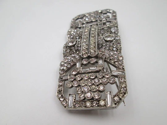 Art deco women's brooch. Sterling silver and rhinestones. Openwork design. Europe. 1930s