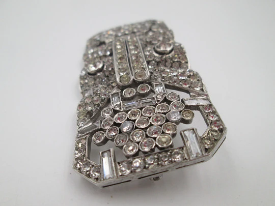 Art deco women's brooch. Sterling silver and rhinestones. Openwork design. Europe. 1930s