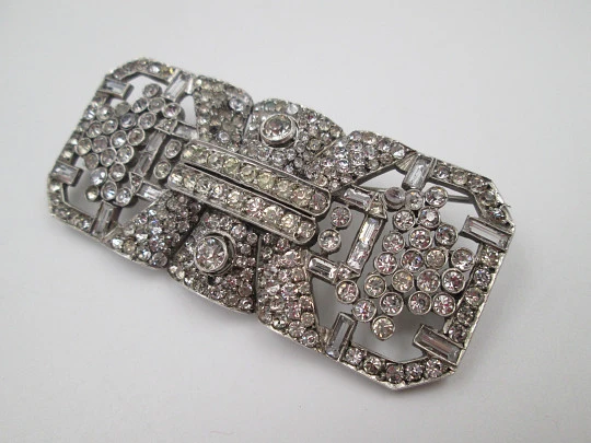Art deco women's brooch. Sterling silver and rhinestones. Openwork design. Europe. 1930s
