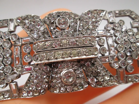 Art deco women's brooch. Sterling silver and rhinestones. Openwork design. Europe. 1930s