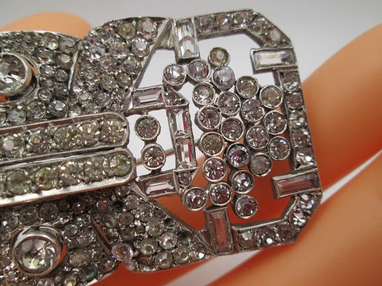 Art deco women's brooch. Sterling silver and rhinestones. Openwork design. Europe. 1930s