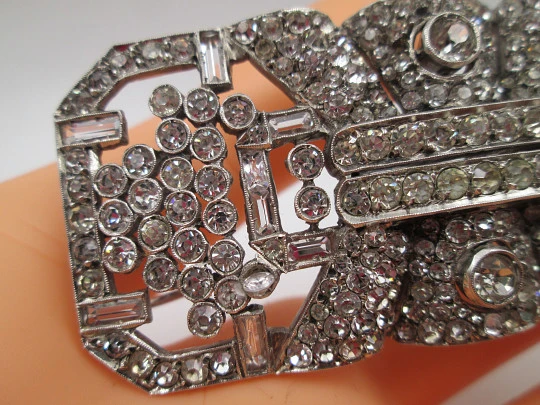 Art deco women's brooch. Sterling silver and rhinestones. Openwork design. Europe. 1930s