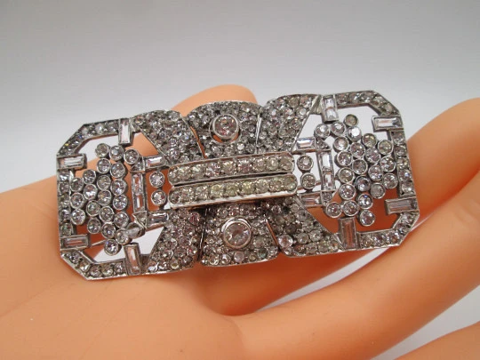 Art deco women's brooch. Sterling silver and rhinestones. Openwork design. Europe. 1930s