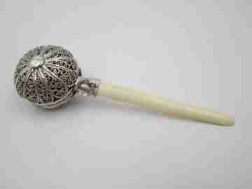 Baby rattle. Sterling silver. Openwork filigree sphere and ivory handle. 1970's
