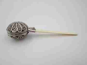 Baby rattle. Sterling silver. Openwork filigree sphere and ivory handle. 1970's
