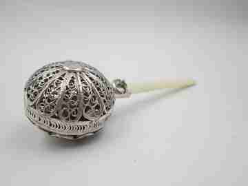 Baby rattle. Sterling silver. Openwork filigree sphere and ivory handle. 1970's