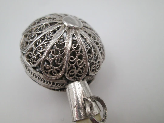 Baby rattle. Sterling silver. Openwork filigree sphere and ivory handle. 1970's