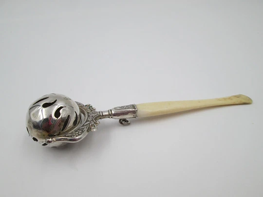 Baby rattle. Sterling silver. Openwork sphere and ivory handle. Box. 1960's. Floral motifs