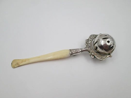 Baby rattle. Sterling silver. Openwork sphere and ivory handle. Box. 1960's. Floral motifs