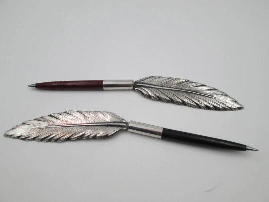 Bird's feather shape ballpoint pen holders. Silver plated and colours plastic. Spain. 1980's