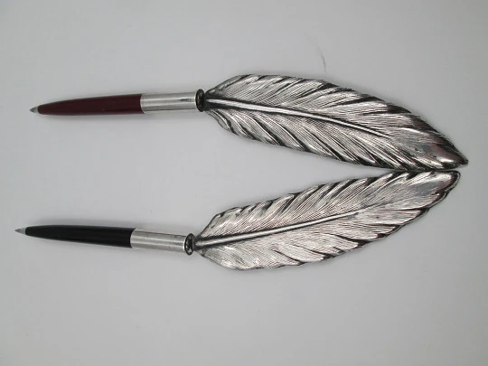 Bird's feather shape ballpoint pen holders. Silver plated and colours plastic. Spain. 1980's