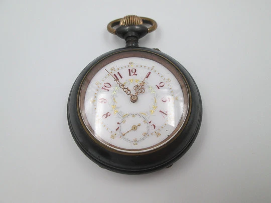 Blued iron and gold metal pocket watch. Decorated porcelain dial. Remontoir. 1900