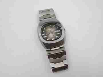 Briter. Steel. Manual wind. Iridescent dial. Date and day. Bracelet. 1970's. Swiss