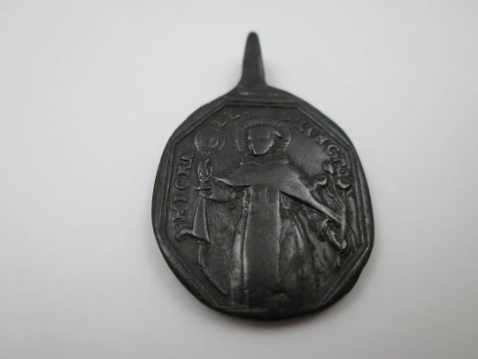 Bronze medal. Saint Michael and Jesus of Nazareth. High relief. Ring on top. 18th century