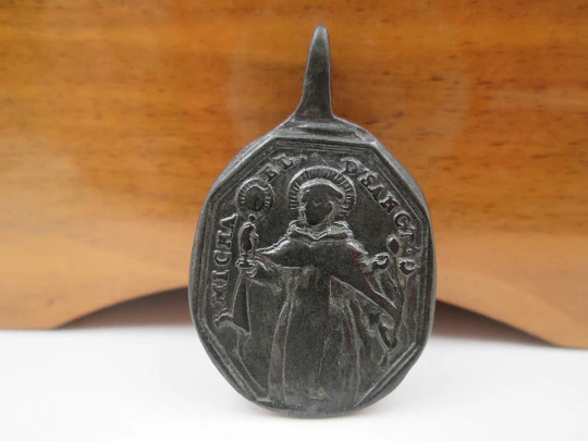 Bronze medal. Saint Michael and Jesus of Nazareth. High relief. Ring on top. 18th century