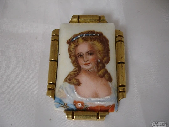 Brooch. Golden metal and Limoges porcelain. 1940's. Woman motif